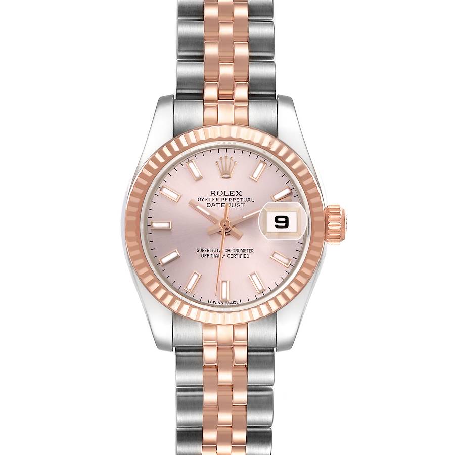 The Rolex Datejust is shown from the front, displaying its pink dial, two-tone bracelet, fluted bezel, and date window at 3 o'clock.
