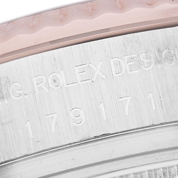 The image shows the side view of the Rolex Datejust 179171 Men
s Steel and Gold (two tone) Pink Dial 179171 Men
s Steel and Gold (two tone) Pink Dial
s case, highlighting engravings and part of the bezel.