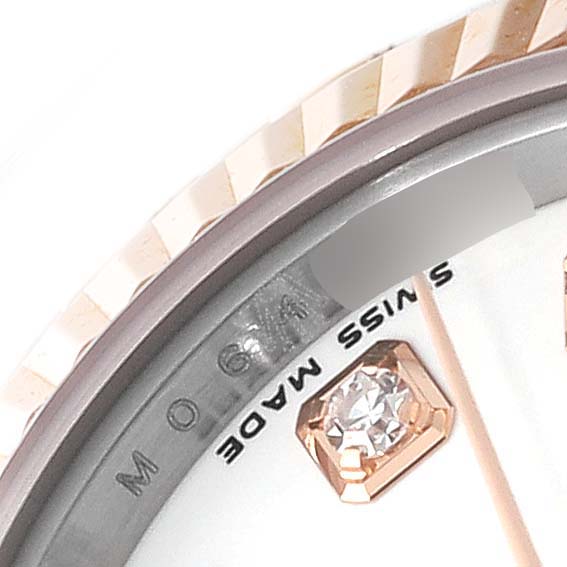 This image shows a close-up of the bezel, dial, and a diamond marker of the Rolex Datejust 179171 Women's Steel and Gold (two tone) White Dial 179171 Women's Steel and Gold (two tone) White Dial watch.