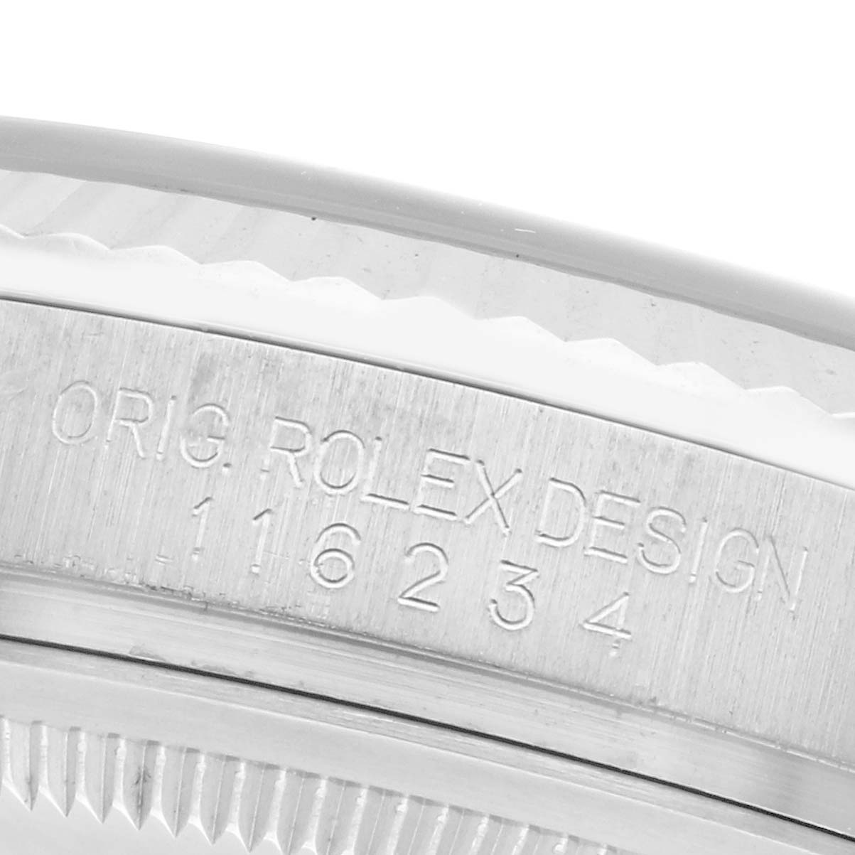 The image shows a close-up of the Rolex Datejust 116234 Men's Stainless Steel Black Dial 116234 Men's Stainless Steel Black Dial's case side, highlighting the model and design engravings.