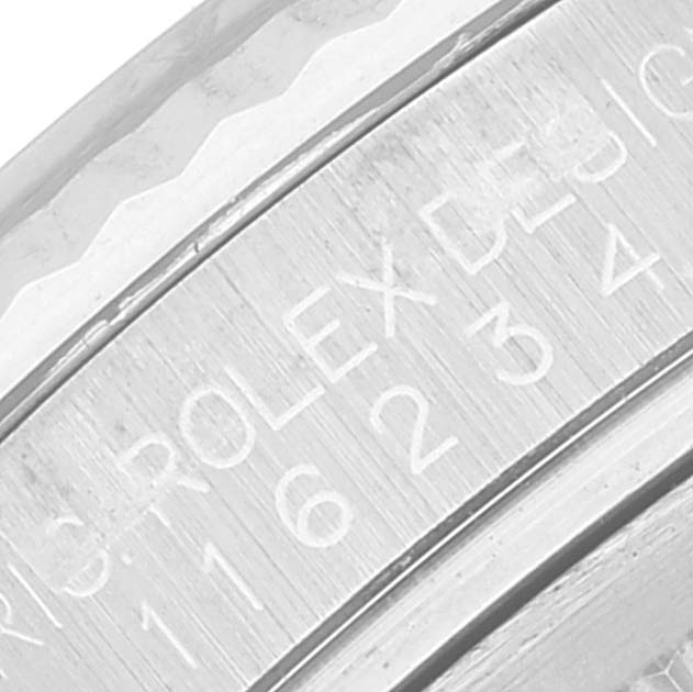 This image shows a close-up of the engraved inner bezel of a Rolex Datejust 116234 Men's Stainless Steel Mother of Pearl Dial 116234 Men's Stainless Steel Mother of Pearl Dial watch.