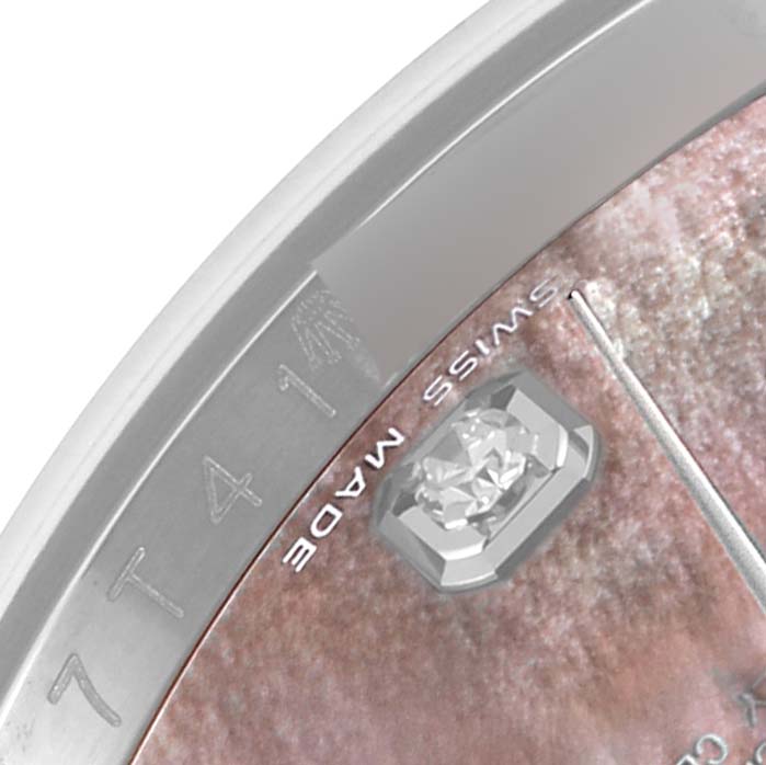 This close-up image shows part of the dial and bezel of a Rolex Datejust 116234 Men's Stainless Steel Mother of Pearl Dial 116234 Men's Stainless Steel Mother of Pearl Dial watch, featuring a diamond marker and "Swiss Made" text.