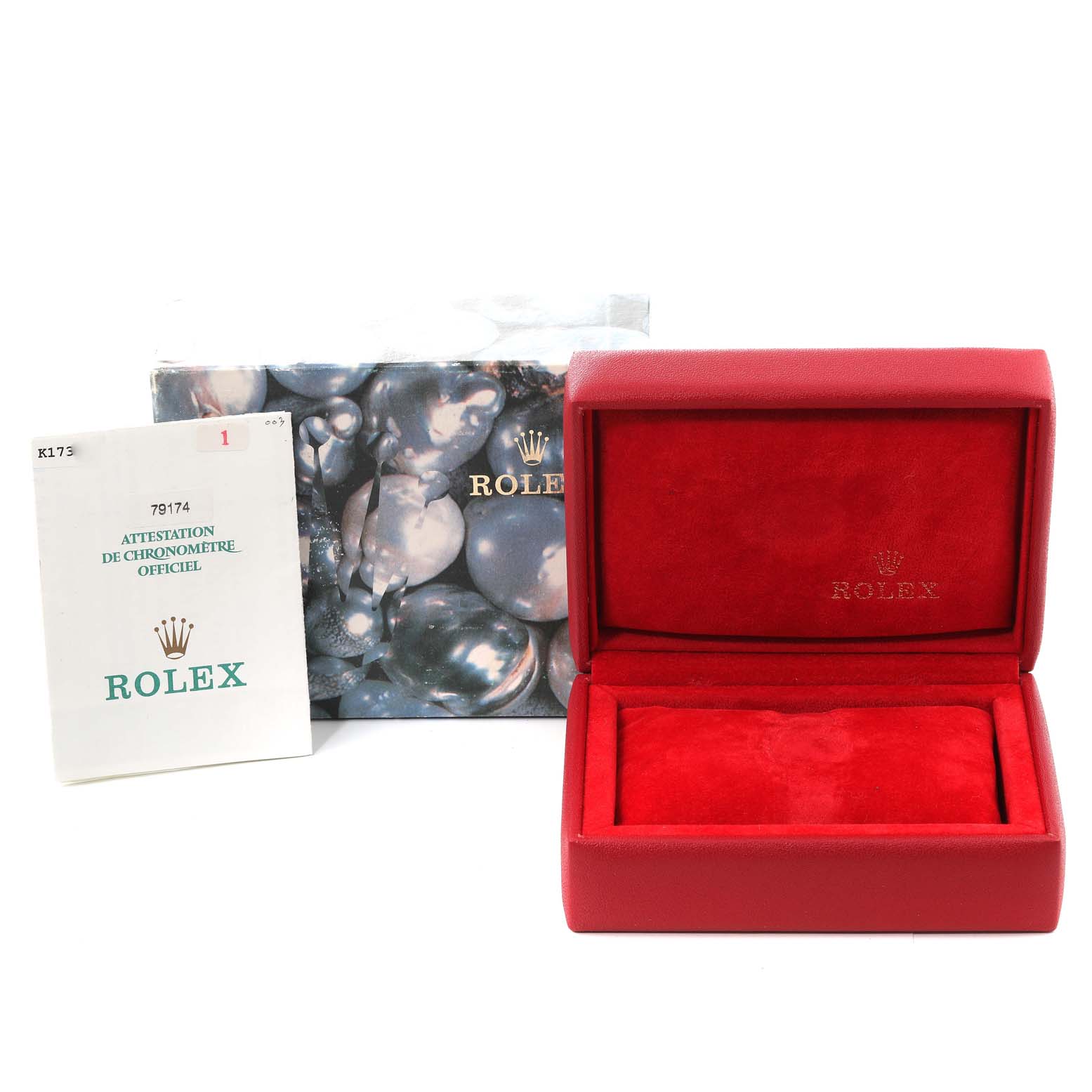 The image shows the packaging, certification booklet, and empty presentation box for a Rolex Datejust 79174 Women's Stainless Steel Pink Dial 79174 Women's Stainless Steel Pink Dial model.