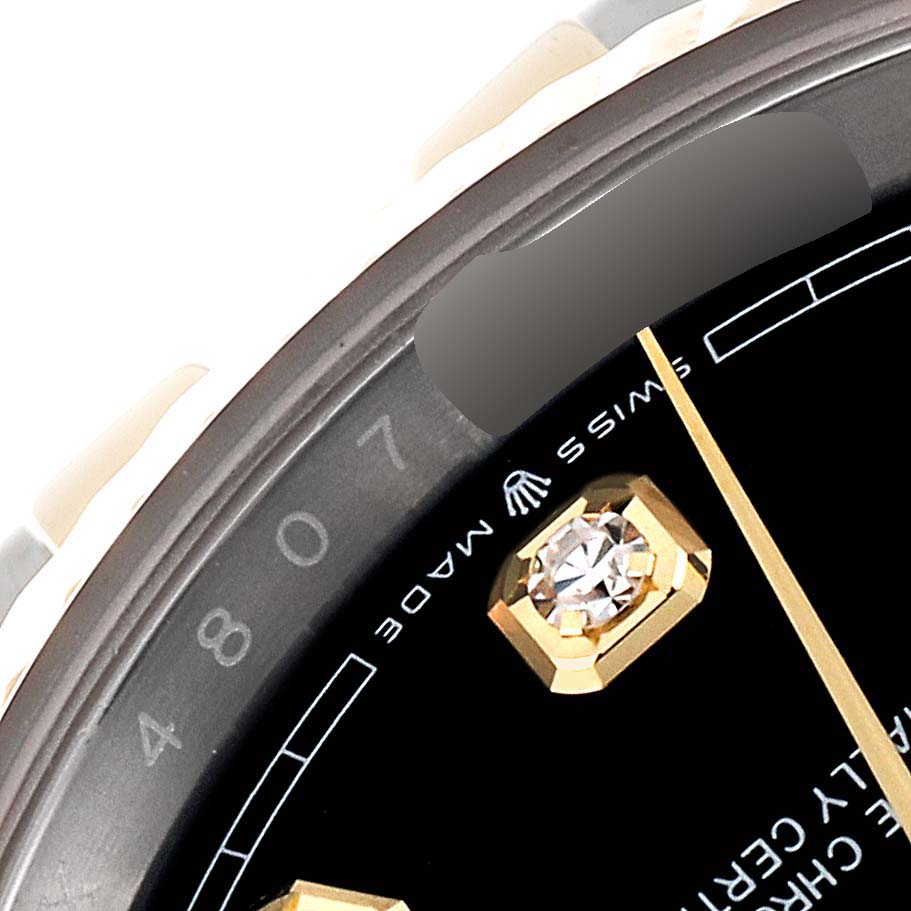 The image shows a close-up angle of the Rolex Datejust 126233 Men's Steel and Gold (two tone) Black Dial 126233 Men's Steel and Gold (two tone) Black Dial watch's dial, highlighting the "Swiss Made" text and diamond marker.