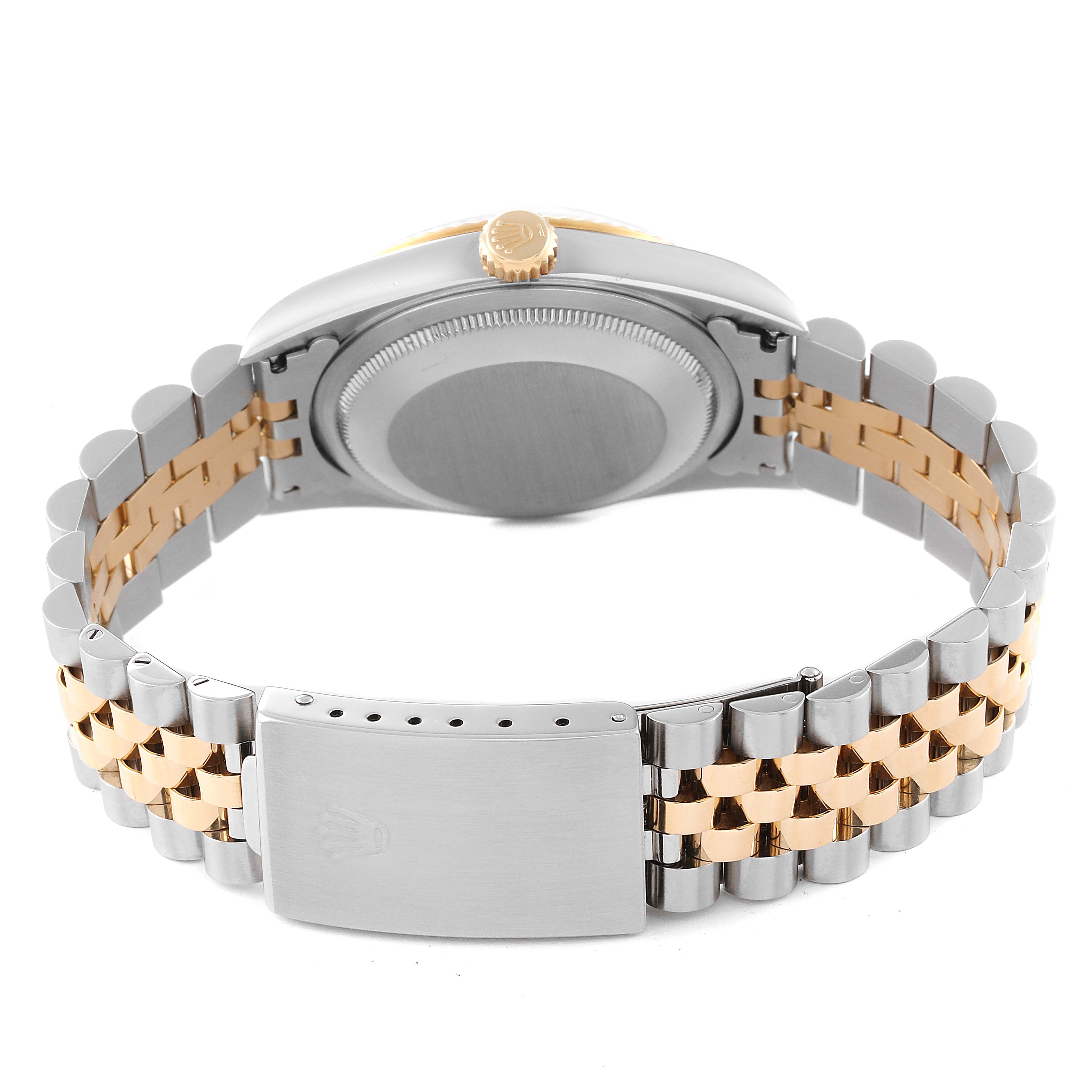 The image shows the back and side of a Rolex Datejust 16233 Men's Steel and Gold (two tone) Blue Dial 16233 Men's Steel and Gold (two tone) Blue Dial watch, including its stainless steel and gold bracelet and clasp.