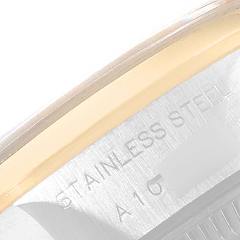 The image shows a close-up angle of the case side of a Rolex Datejust 79163 Women's Steel and Gold (two tone) Champagne Dial 79163 Women's Steel and Gold (two tone) Champagne Dial watch, highlighting the "STAINLESS STEEL" engraving.