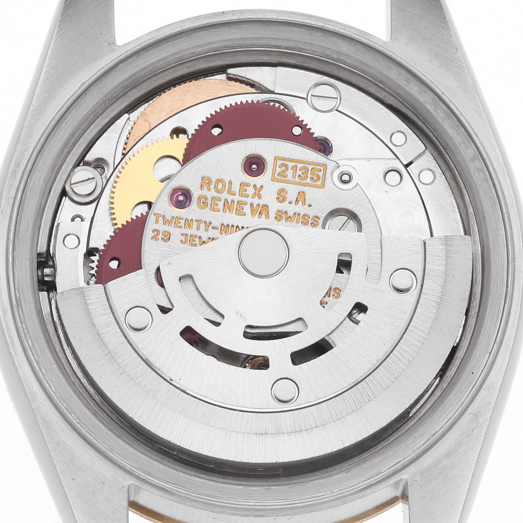 The image shows the movement of a Rolex Datejust 69173 Women's Steel and Gold (two tone) Champagne Dial 69173 Women's Steel and Gold (two tone) Champagne Dial watch from a rear angle, highlighting gears and the oscillating weight.