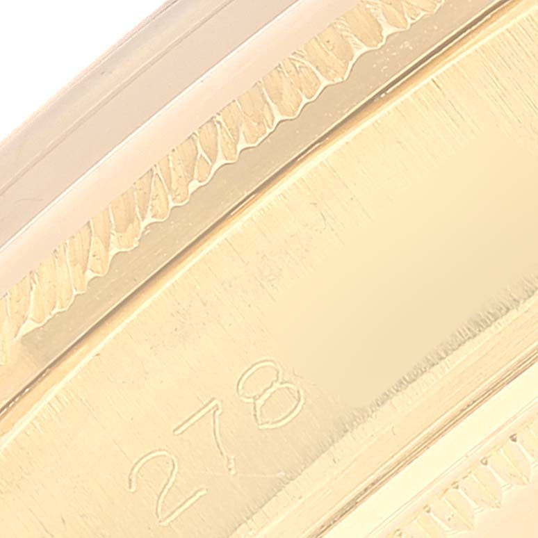 The image shows a close-up of the side case and engraved number of a Vintage Collection model by Rolex.