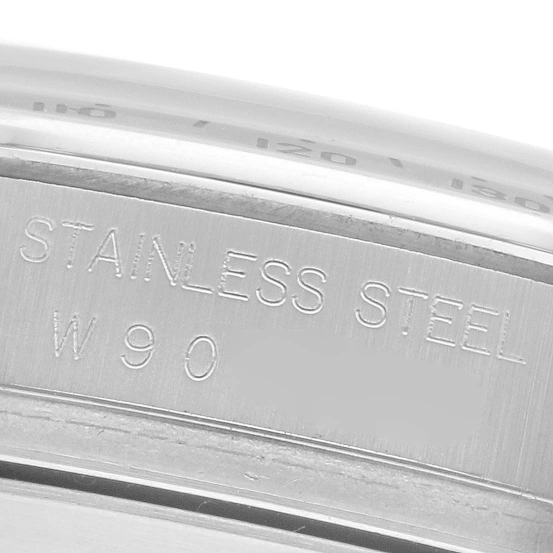 The image shows a close-up of the inner engraving on a Rolex Daytona 16520 Men
s Stainless Steel White Dial 16520 Men
s Stainless Steel White Dial
s stainless steel caseback.