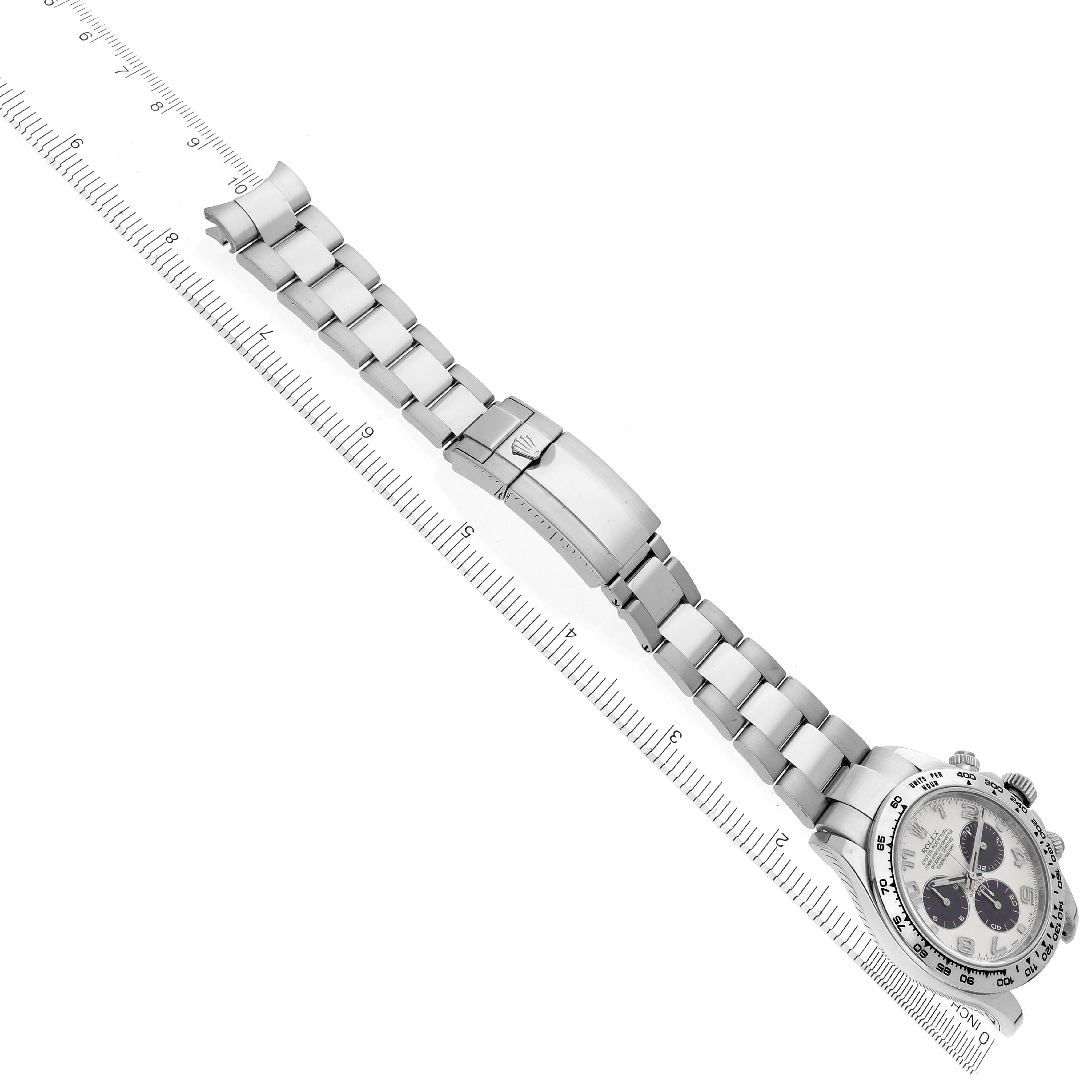 The Rolex Daytona 116509 Men's White Gold Silver Dial 116509 Men's White Gold Silver Dial watch is shown at a diagonal angle, featuring the bracelet and clasp with a ruler measuring its length.