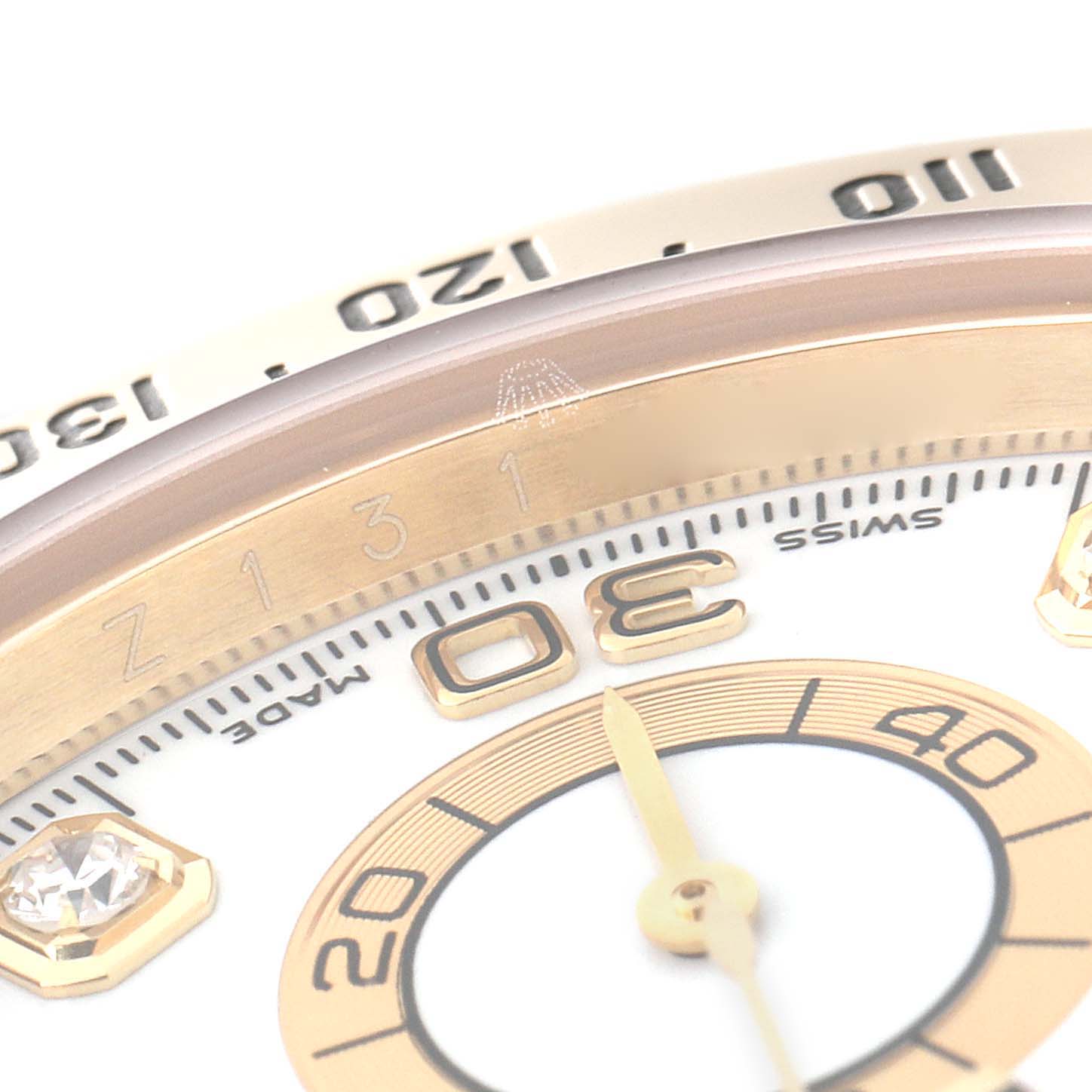 Close-up angle of the Rolex Daytona 116528 Men's Yellow Gold White Dial 116528 Men's Yellow Gold White Dial watch showing the dial, hands, and bezel details.