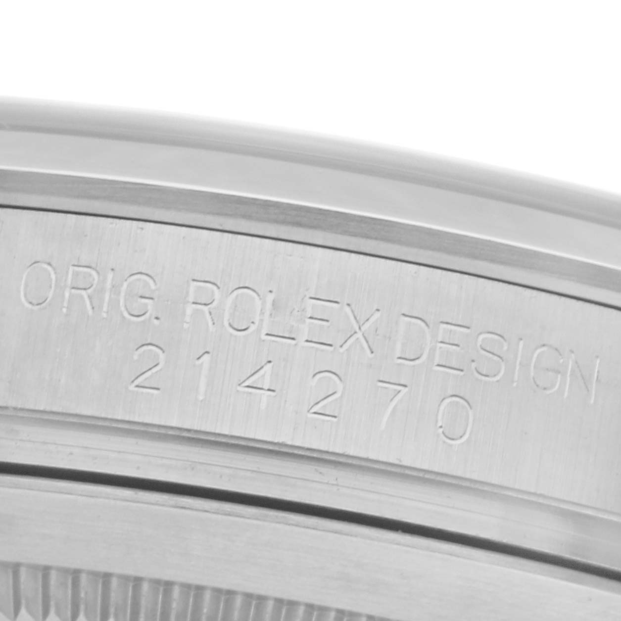 The image shows a close-up of the Rolex Explorer 214270 Men
s Stainless Steel Black Dial 214270 Men
s Stainless Steel Black Dial
s side with engraved details and model number 214270.