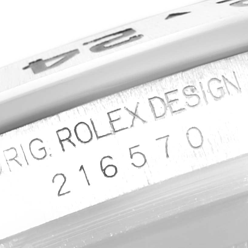The image shows the serial number and engraved "Rolex Design" on the side of a Rolex Explorer 216570 Men's Stainless Steel White Dial 216570 Men's Stainless Steel White Dial model watch.