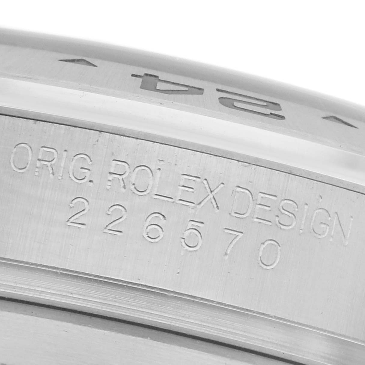 The image shows the engraved side of a Rolex GMT-Master 226570 Men's Stainless Steel Black Dial 226570 Men's Stainless Steel Black Dial watch case, featuring the model number.