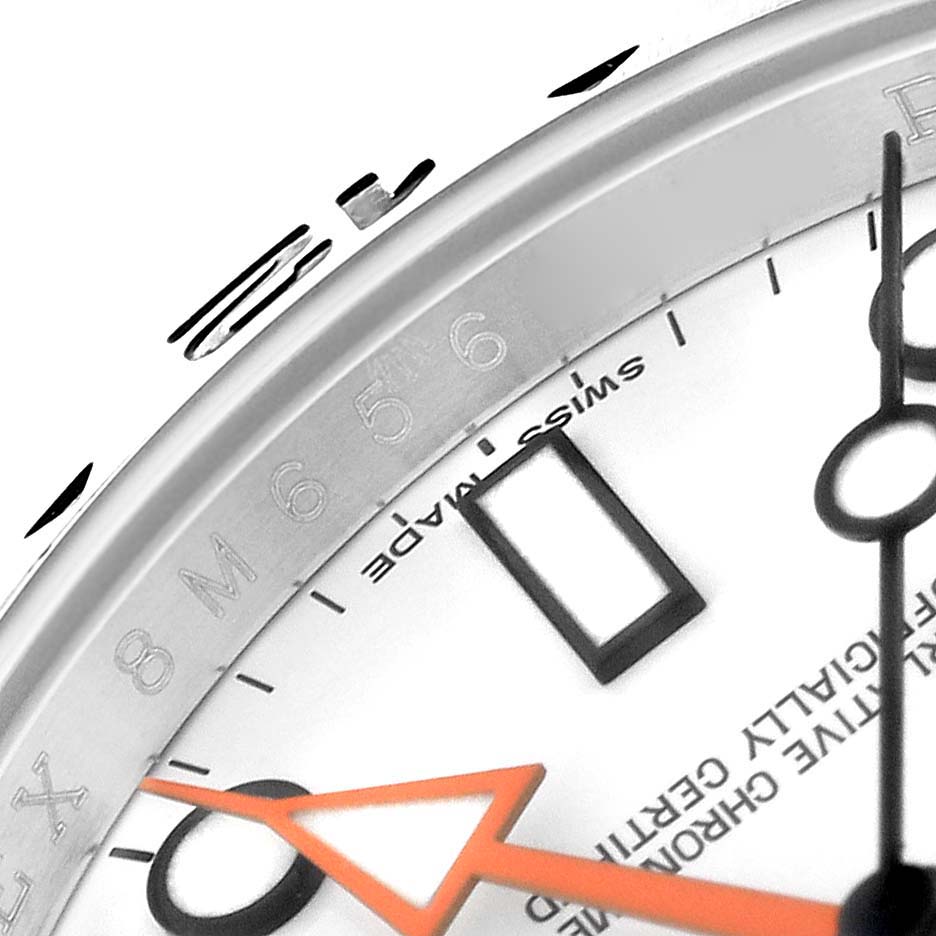 This close-up shows the dial, hands, and part of the bezel of the Rolex Explorer 216570 Men's Stainless Steel White Dial 216570 Men's Stainless Steel White Dial watch model.