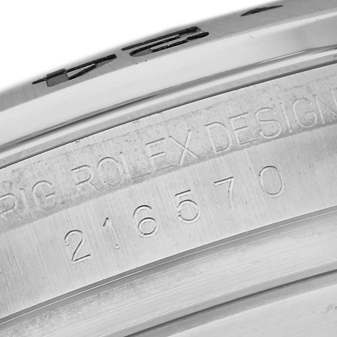 The image shows an angled close-up of the inner bezel and serial number of a Rolex Explorer 216570 Men
s Stainless Steel White Dial 216570 Men
s Stainless Steel White Dial.