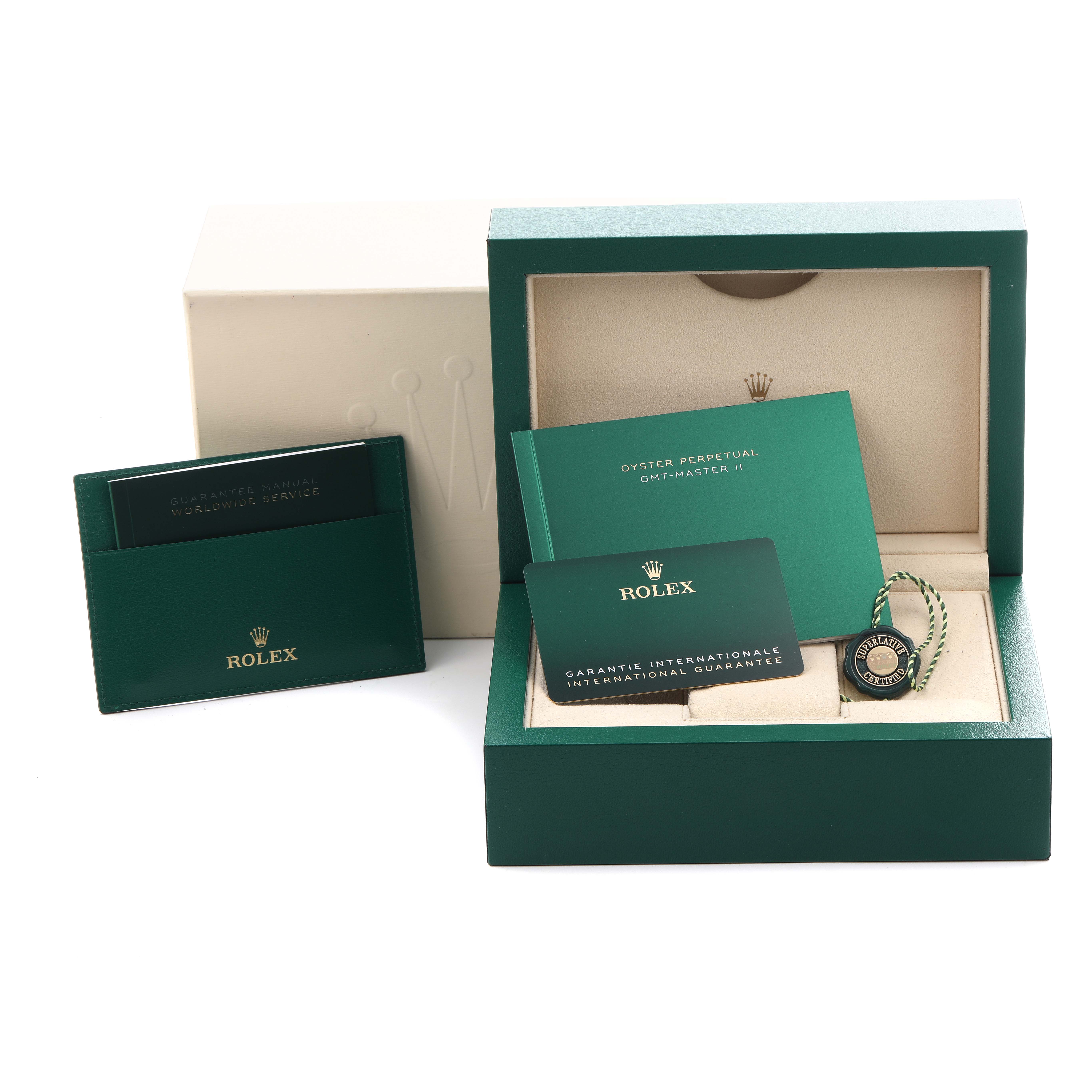 The image shows a Rolex GMT-Master 126710 Men's Stainless Steel Black Dial 126710 Men's Stainless Steel Black Dial box with a guarantee card, manuals, and a tag from a top-front angle.