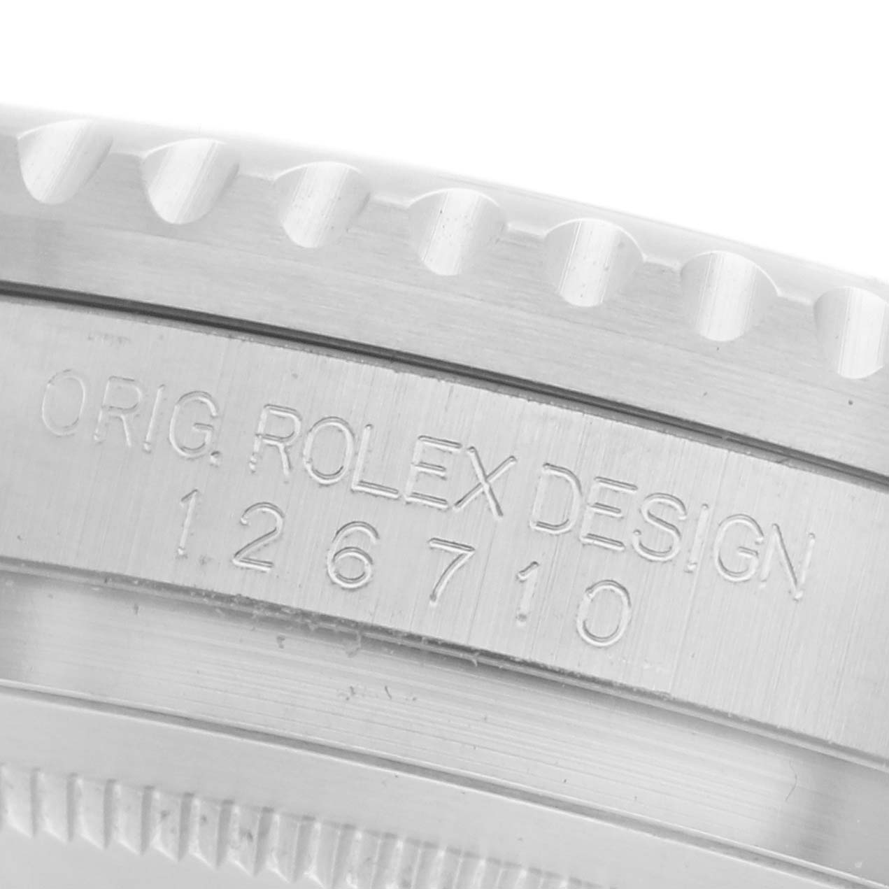 The close-up image shows the engraved side of the case on a Rolex GMT-Master 126710 Men's Stainless Steel Black Dial 126710 Men's Stainless Steel Black Dial watch, highlighting the model number.