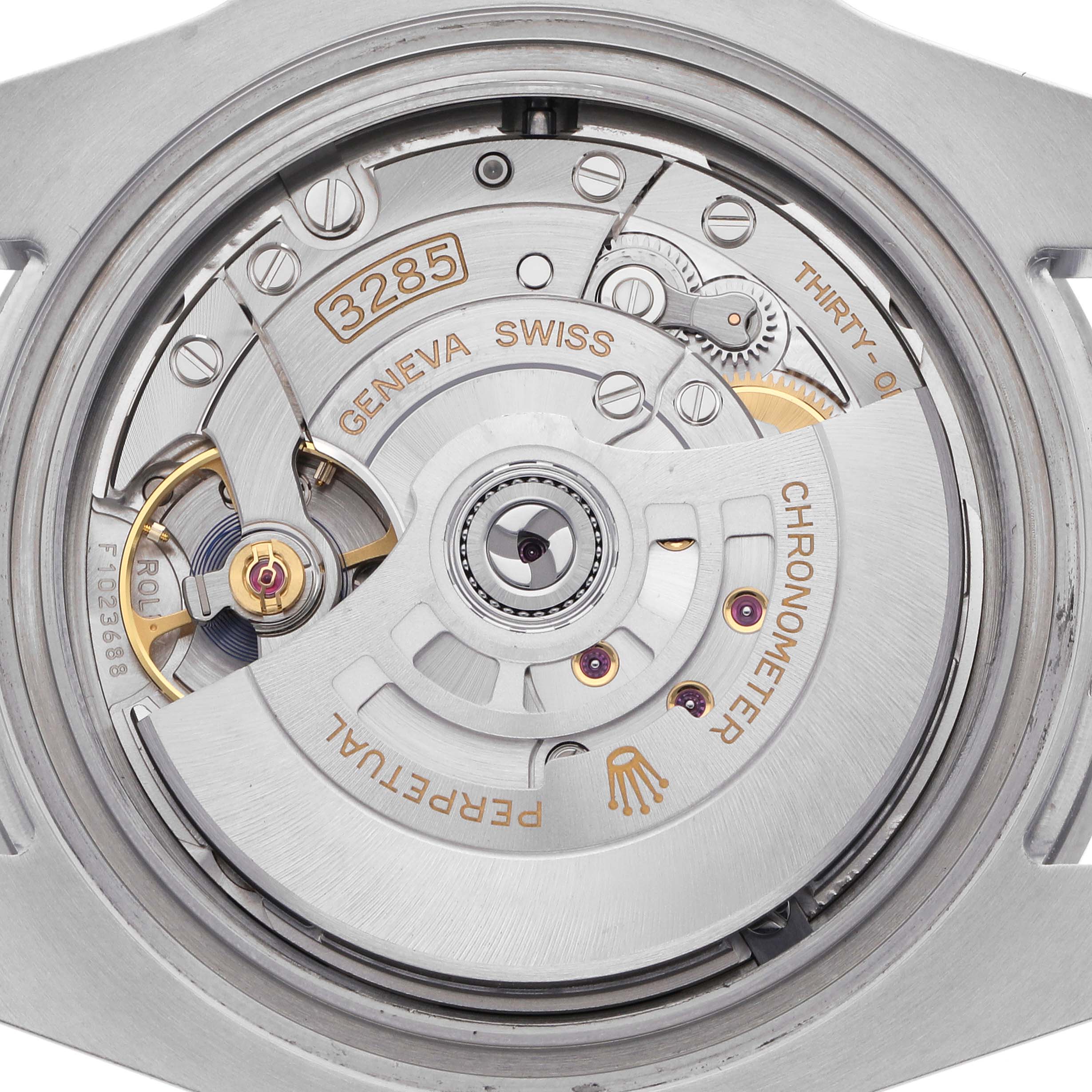 The image shows the Rolex GMT-Master 126710 Men's Stainless Steel Black Dial 126710 Men's Stainless Steel Black Dial's movement from a rear angle, highlighting the rotor, gears, and engravings.