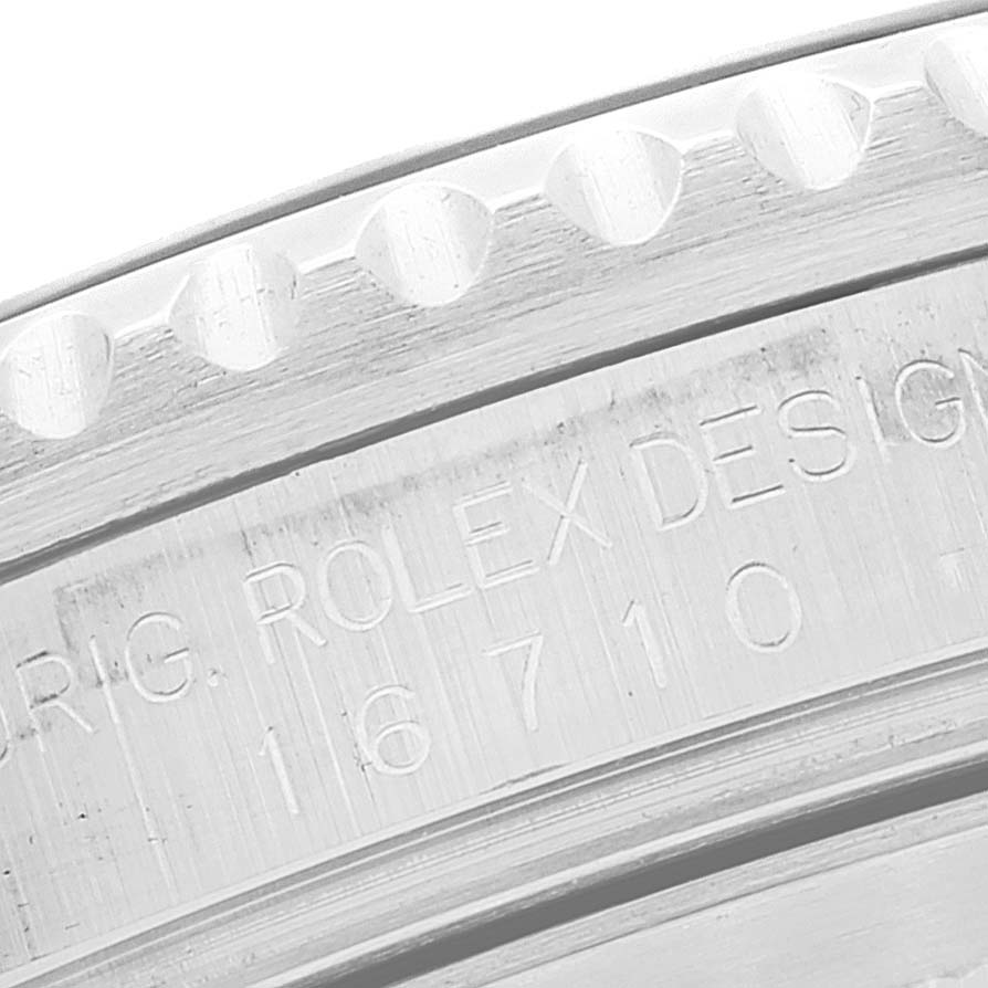 The image shows a close-up of the inner bezel and engraving on a Rolex GMT-Master 16710 Men
s Stainless Steel Black Dial 16710 Men
s Stainless Steel Black Dial watch.
