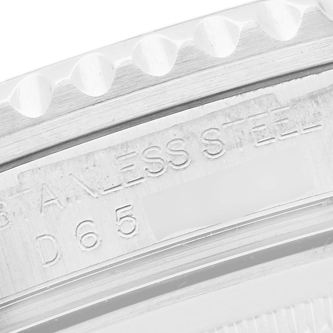 This image shows a close-up of the bezel and case side engraving on a Rolex GMT-Master 16710 Men
s Stainless Steel Black Dial 16710 Men
s Stainless Steel Black Dial watch.