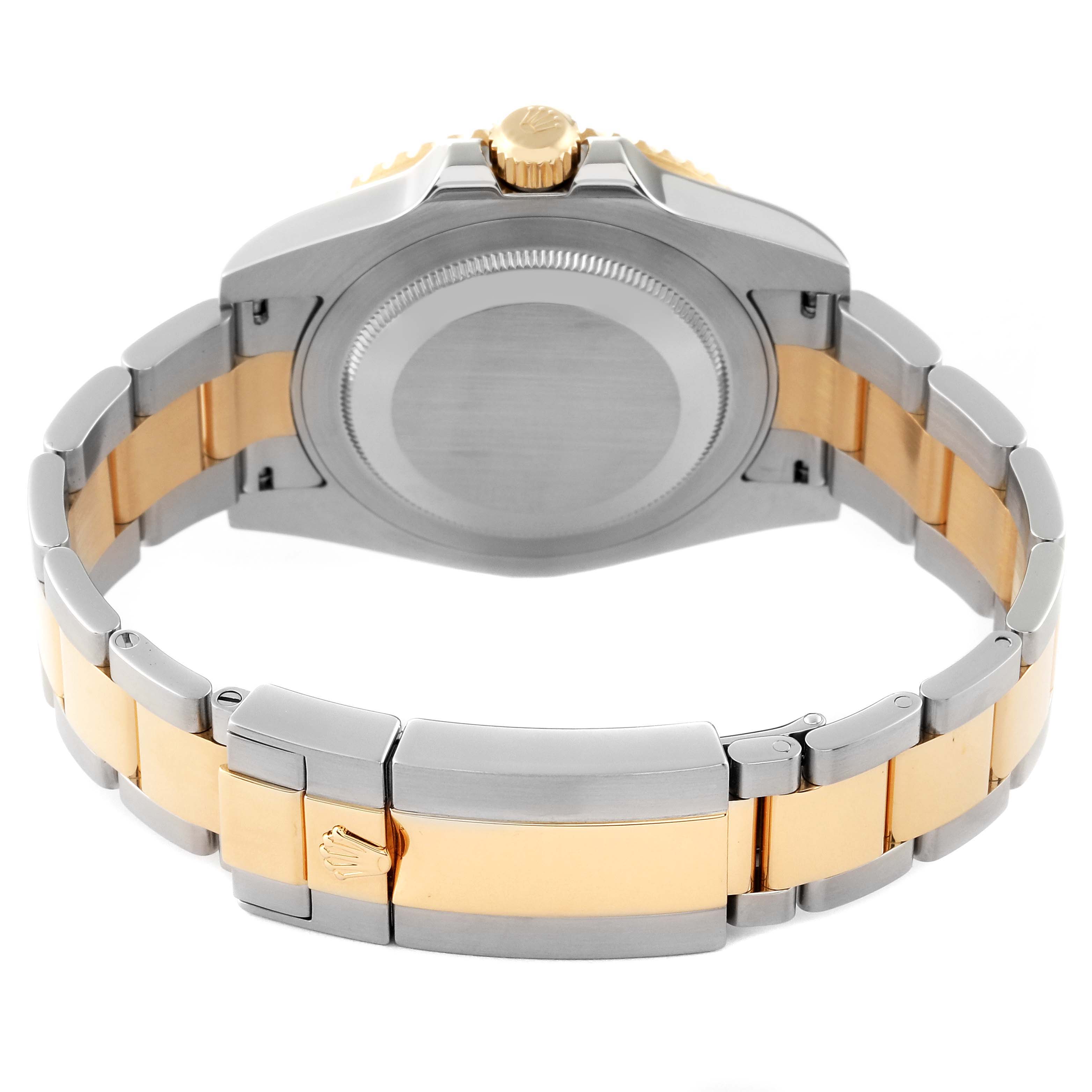 The image shows the back and bracelet of a Rolex GMT-Master 116713 Men's Steel and Gold (two tone) Black Dial 116713 Men's Steel and Gold (two tone) Black Dial watch, highlighting its two-tone metal design and clasp.