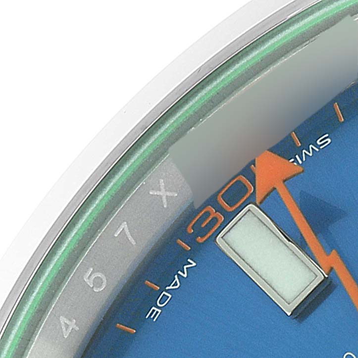 This close-up angle of the Rolex Milgauss 116400 Men
s Stainless Steel Blue Dial 116400 Men
s Stainless Steel Blue Dial watch shows its blue dial, orange second hand, and partial numerals.