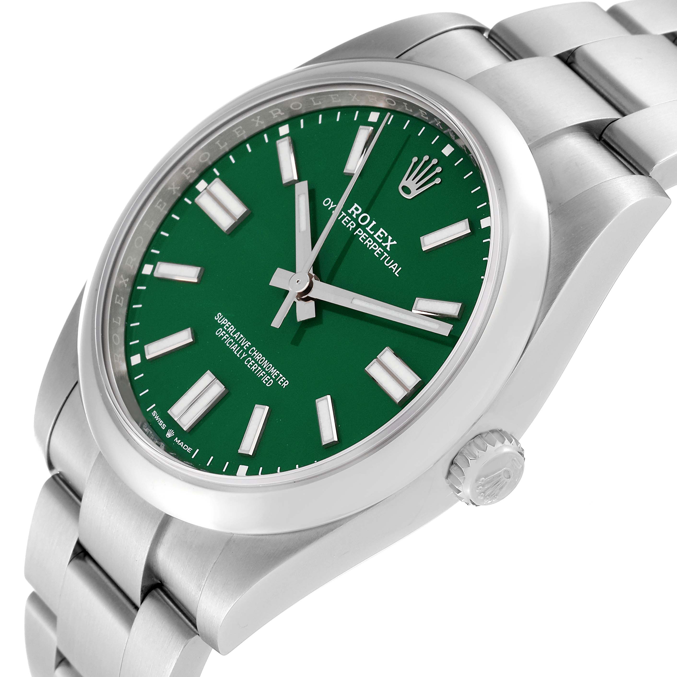 The image shows a close-up, angled view of a Rolex Oyster Perpetual 124300 Men
s Stainless Steel Green Dial 124300 Men
s Stainless Steel Green Dial watch with a green dial and silver bracelet.