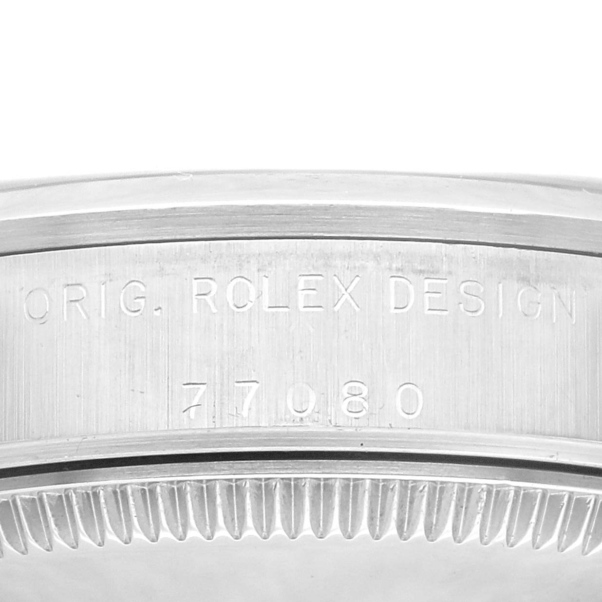 This is a close-up view of the side of the Rolex Oyster Perpetual watch, showing the engraved serial number and "ORIG. ROLEX DESIGN."
