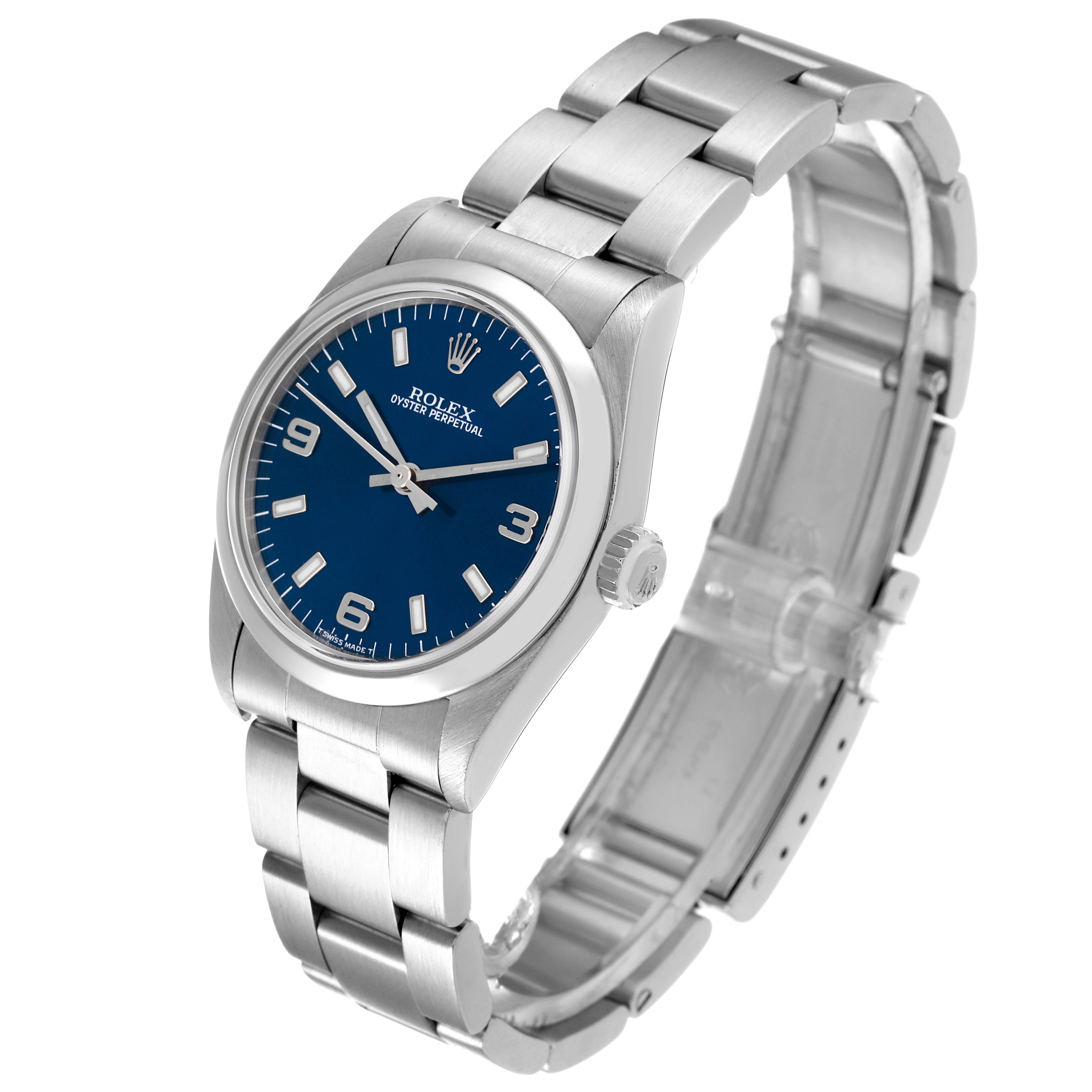 The Rolex Mid-Size 77080 Women
s Stainless Steel Blue Dial 77080 Women
s Stainless Steel Blue Dial watch is shown at a three-quarter angle, displaying its blue dial, bracelet, and crown.