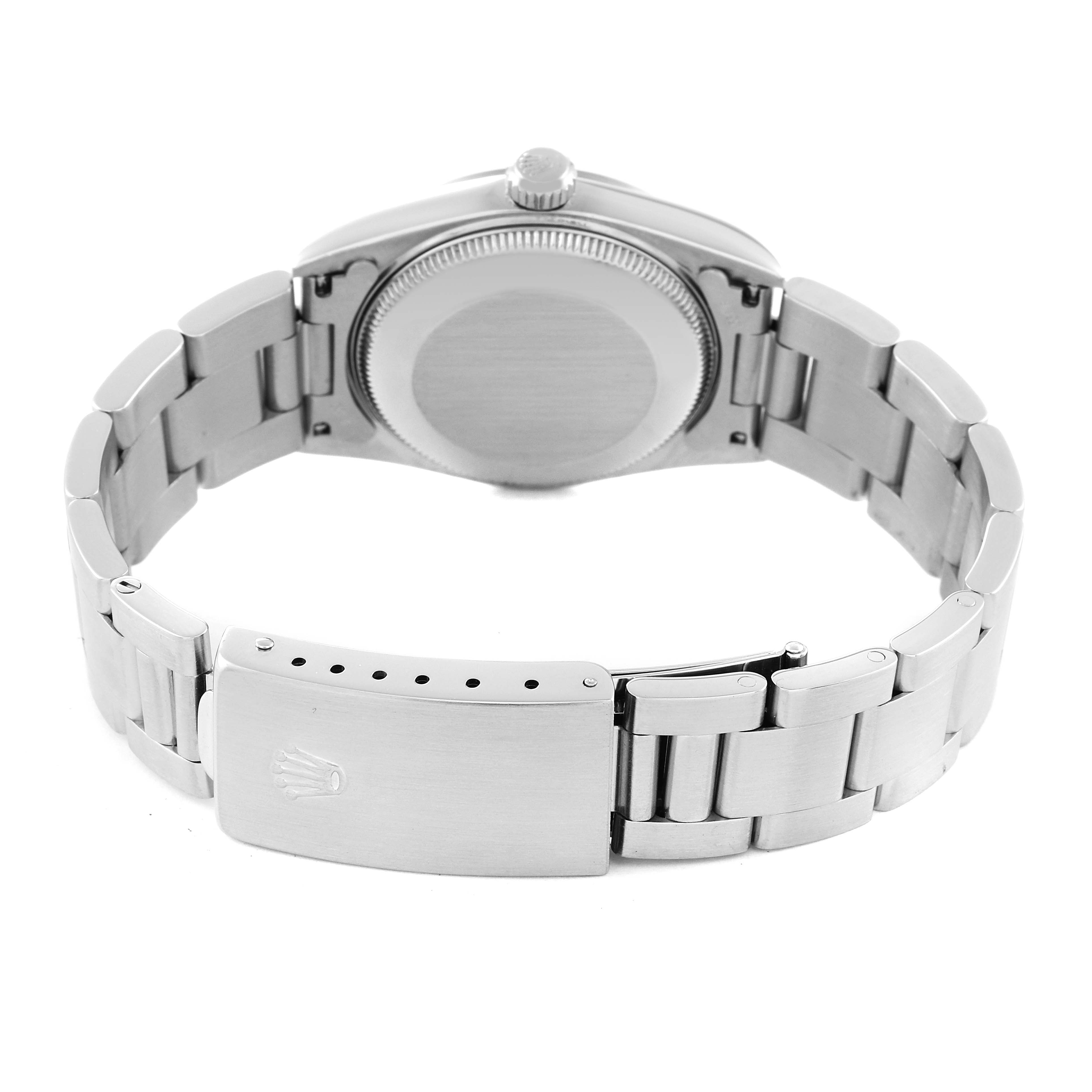 This image shows the back view of a Rolex Mid-Size 77080 Women
s Stainless Steel Blue Dial 77080 Women
s Stainless Steel Blue Dial watch, highlighting the case back, crown, and bracelet clasp.