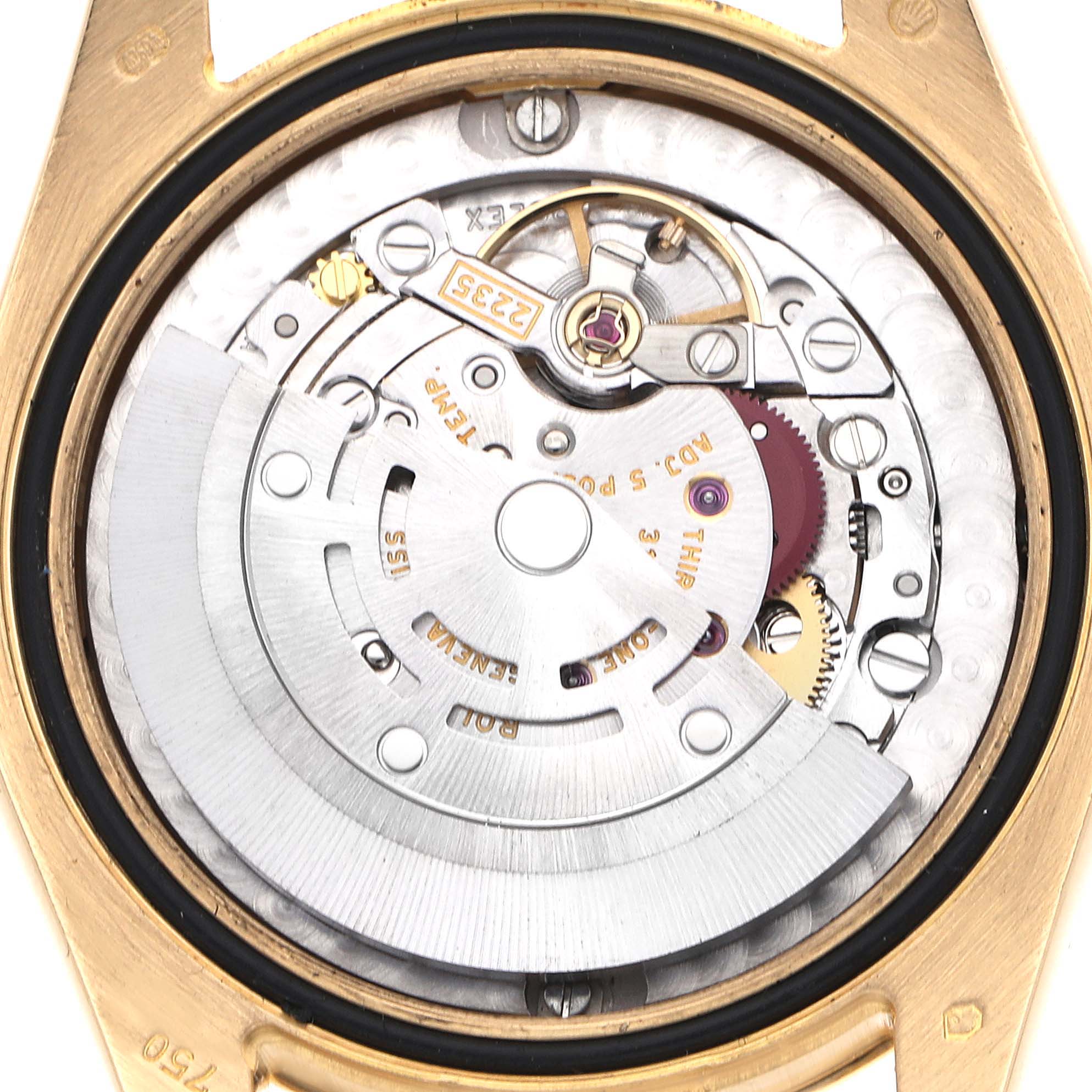 The image shows the movement of a Rolex Mid-Size watch from the back, highlighting the rotor and internal mechanism.