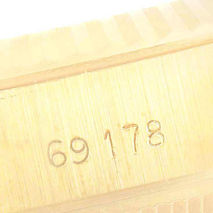 This image shows a close-up angle of the model number "69178" engraved on the case of a Rolex President 69178 Women
s Yellow Gold Champagne Dial 69178 Women
s Yellow Gold Champagne Dial watch.