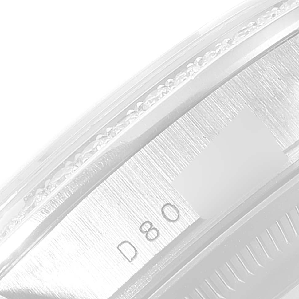 This image shows a close-up view of the side of a Rolex President 118389 Men's White Gold Silver Dial 118389 Men's White Gold Silver Dial model watch, focusing on the engraved details.