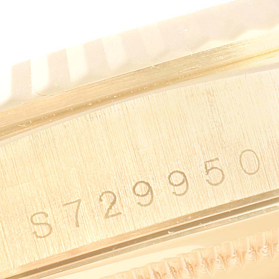 The image shows a close-up of the case side of a Rolex President 18238 Men
s Yellow Gold White Dial 18238 Men
s Yellow Gold White Dial model watch, displaying the engraved serial number.