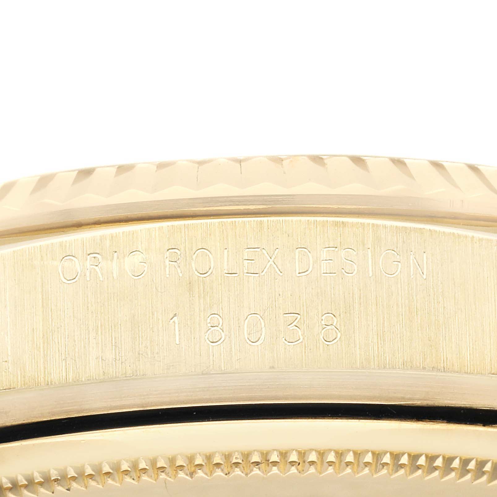 The image shows a close-up of the side of a Rolex President 18038 Men
s Yellow Gold Champagne Dial 18038 Men
s Yellow Gold Champagne Dial model, highlighting its engraved design number "18038."