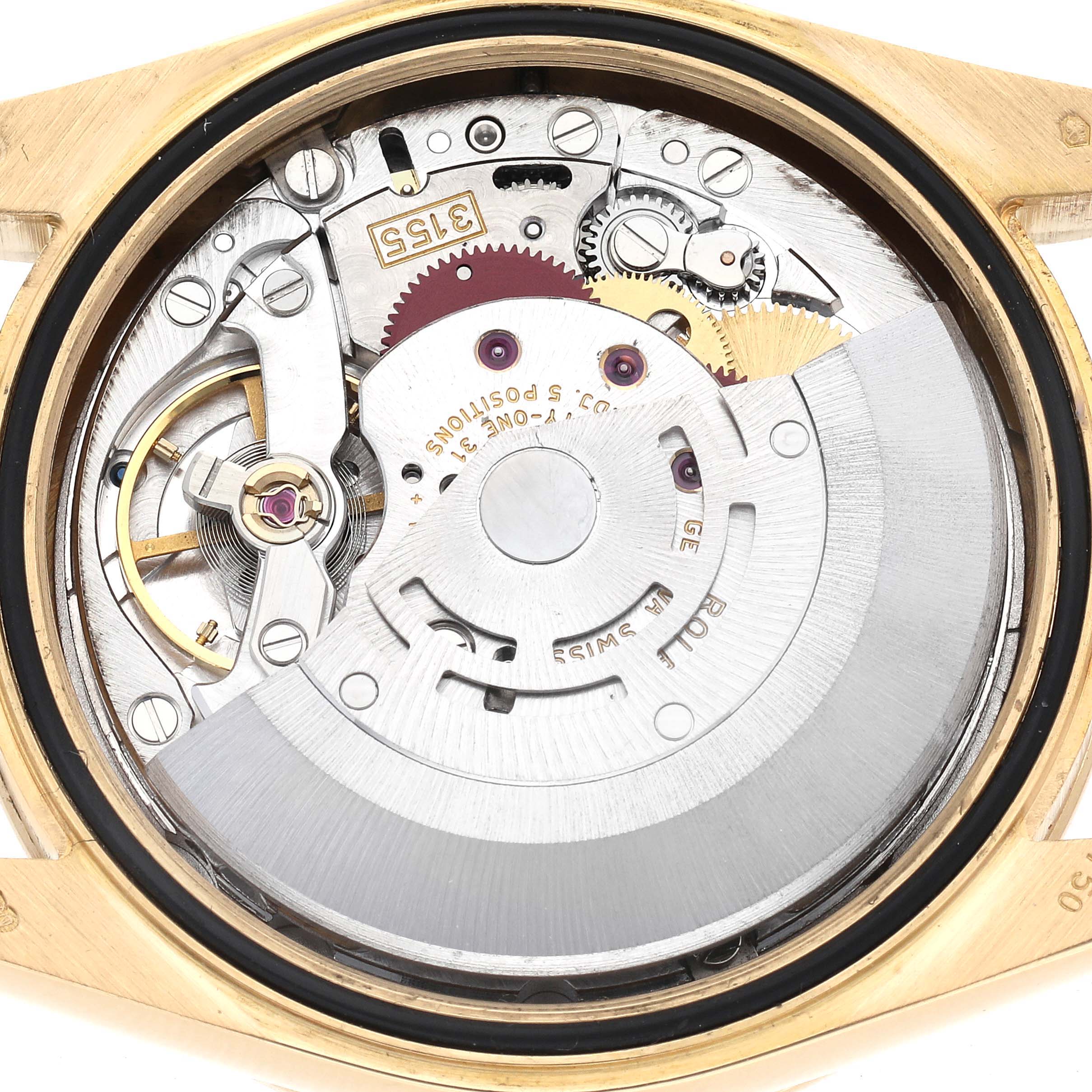The image shows the movement of a Rolex President 118348 Men
s Yellow Gold Champagne Dial 118348 Men
s Yellow Gold Champagne Dial watch from a rear angle, highlighting gears and components.