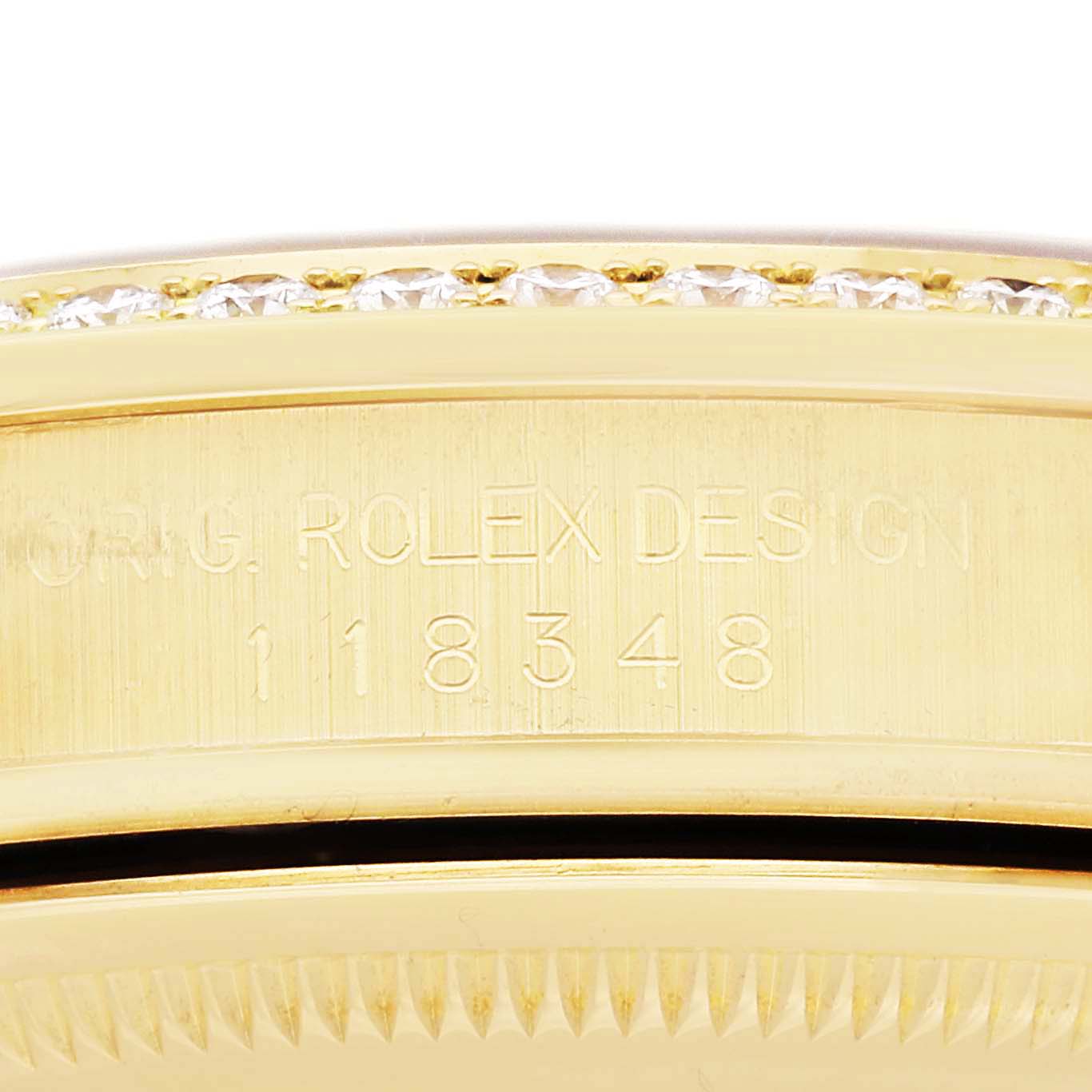 The image shows a close-up of the case side with the engraved serial number and "ORIG. ROLEX DESIGN" on a Rolex President 118348 Men
s Yellow Gold Champagne Dial 118348 Men
s Yellow Gold Champagne Dial model.