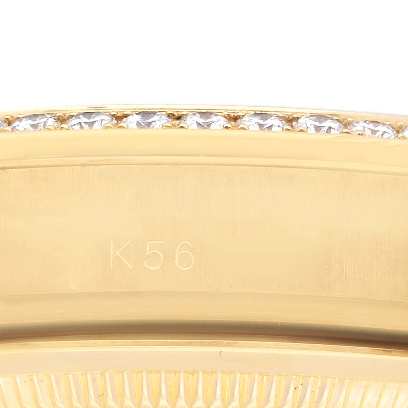 The image shows the side view of a Rolex President 118348 Men
s Yellow Gold Champagne Dial 118348 Men
s Yellow Gold Champagne Dial model watch case with a diamond-set bezel.