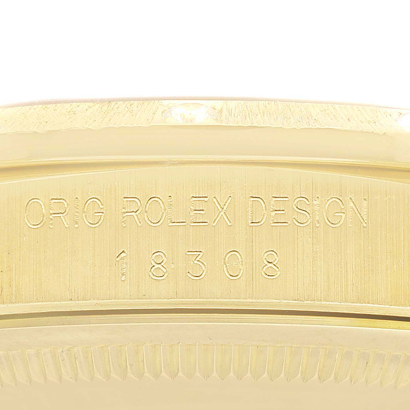 The image shows an engraved side of the Rolex President 18308 Men
s Yellow Gold Champagne Dial 18308 Men
s Yellow Gold Champagne Dial model, focusing on the reference number 18308.