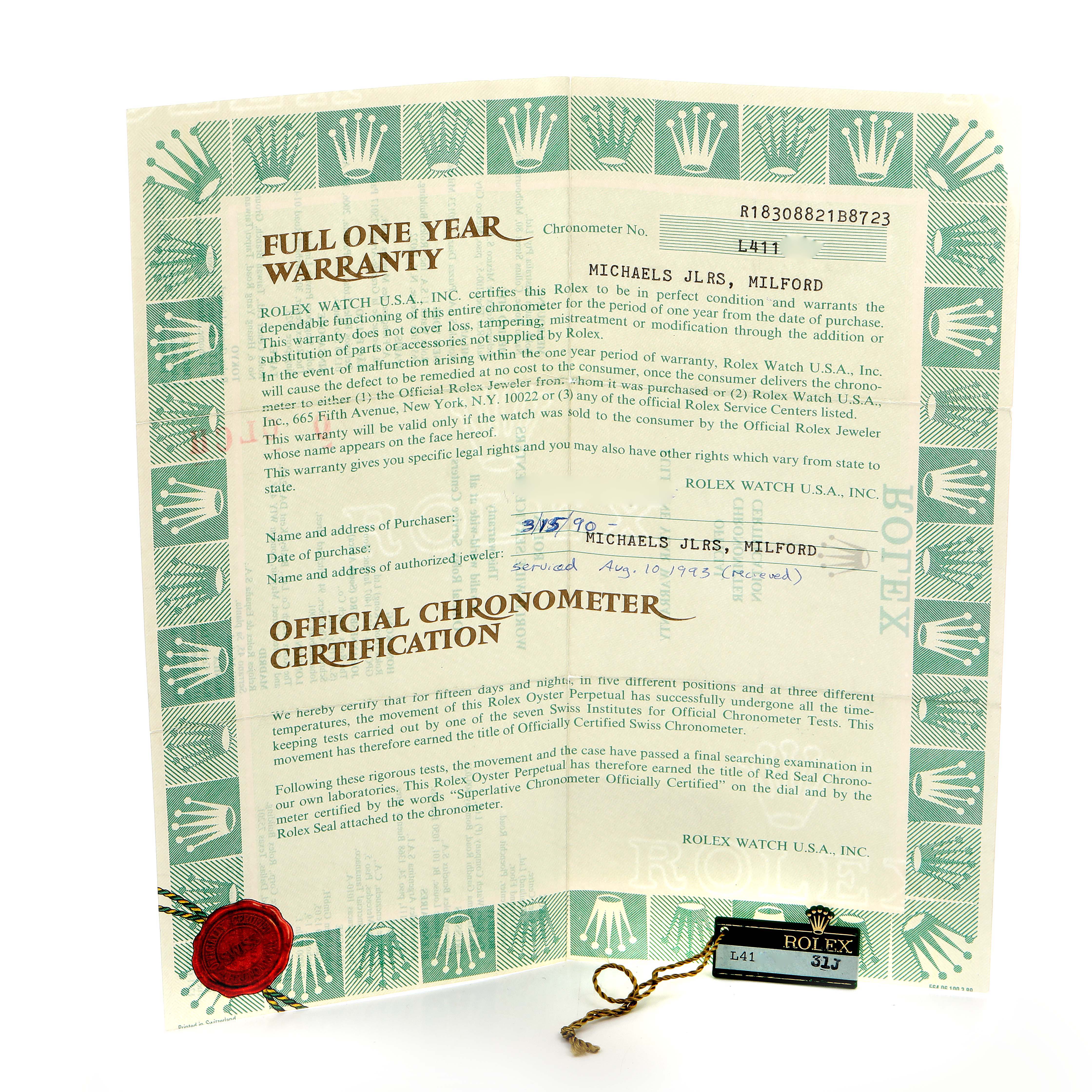 The image shows a Rolex warranty and certification document for the Rolex President 18308 Men
s Yellow Gold Champagne Dial 18308 Men
s Yellow Gold Champagne Dial model, with a tag attached at the bottom.