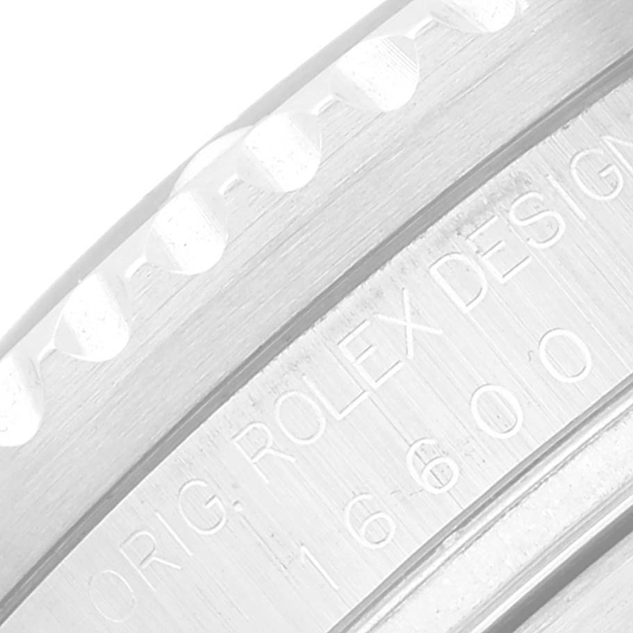 This close-up image shows the side view of the bezel and the engraved inner rim of a Rolex Sea-Dweller 16600 Men
s Stainless Steel Black Dial 16600 Men
s Stainless Steel Black Dial watch.