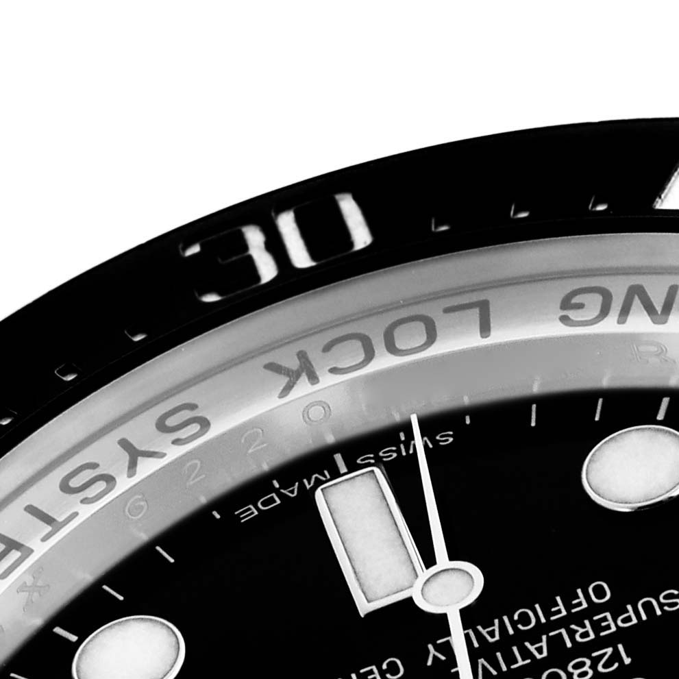 The image shows a close-up of the bezel and dial of the Rolex Sea-Dweller 116660 Men's Stainless Steel Black Dial 116660 Men's Stainless Steel Black Dial, highlighting the "RING LOCK SYSTEM" and time markers.
