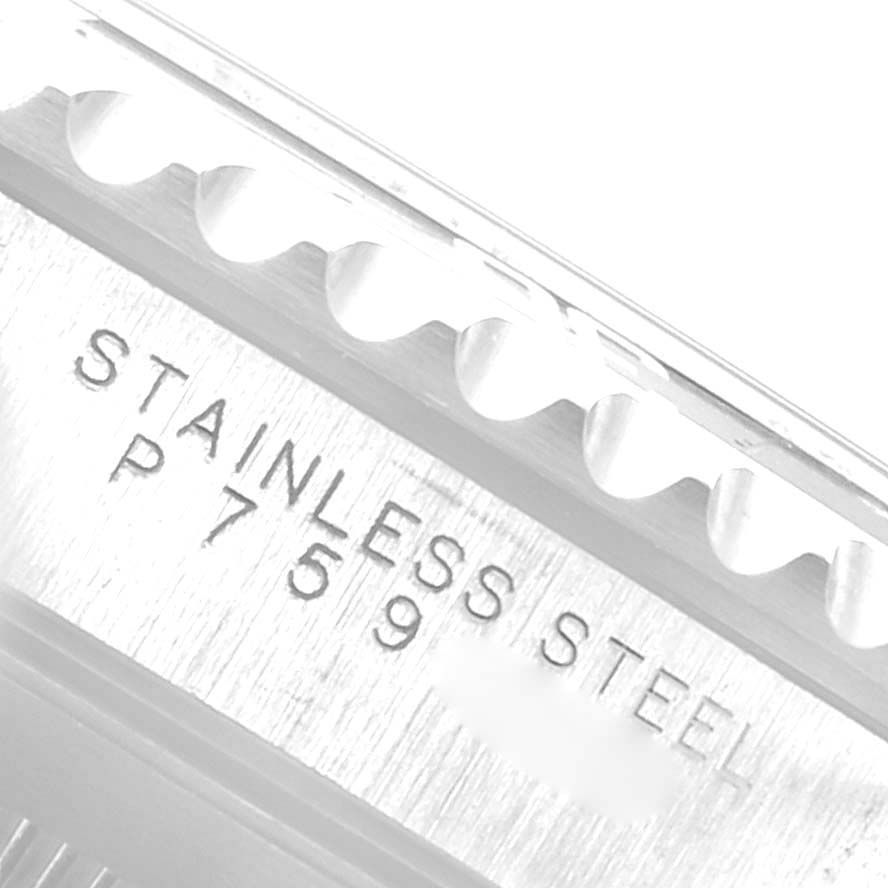 This close-up image shows the side of the bezel and engraved stainless steel text of a Rolex Submariner 14060 Men
s Stainless Steel Black Dial 14060 Men
s Stainless Steel Black Dial watch.