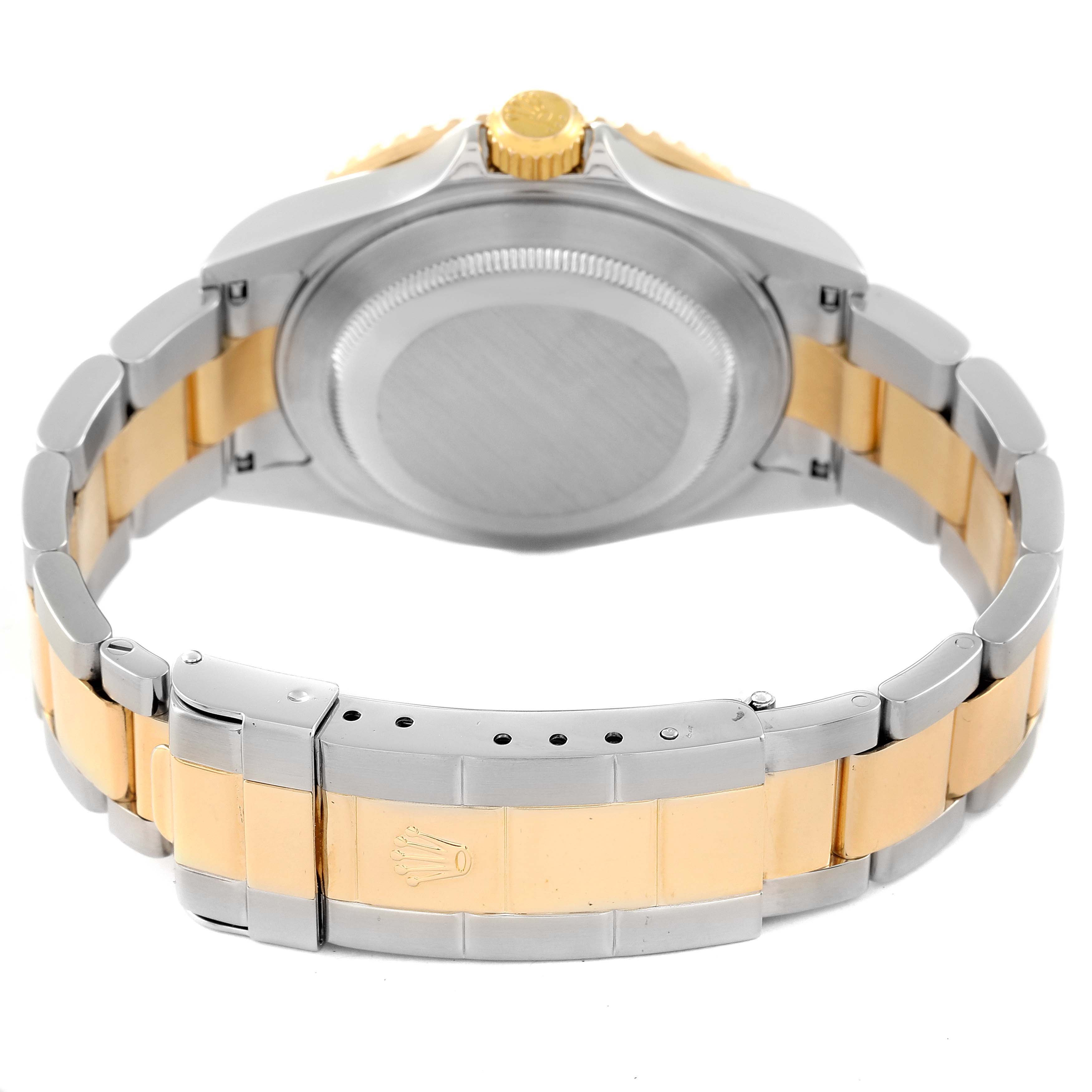 The image shows the back and bracelet of a Rolex Submariner 16613 Men's Steel and Gold (two tone) Blue Dial 16613 Men's Steel and Gold (two tone) Blue Dial watch at a rear angle.