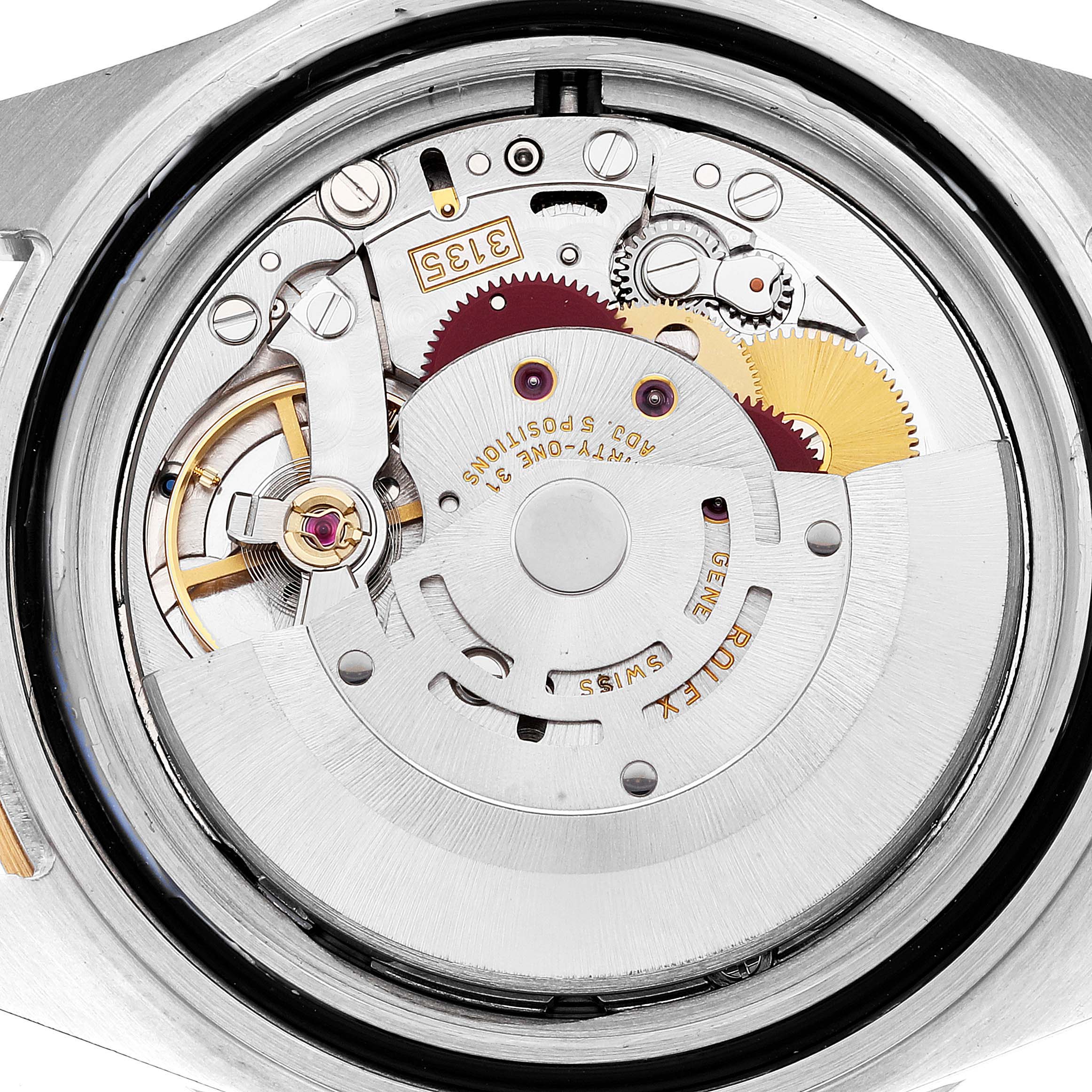 The image shows the internal mechanical movement of a Rolex Submariner 16613 Men's Steel and Gold (two tone) Blue Dial 16613 Men's Steel and Gold (two tone) Blue Dial watch from a close-up, top-down angle.