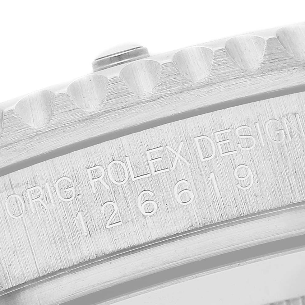 The image shows a close-up of the side of a Rolex Submariner 126619 Men's White Gold Black Dial 126619 Men's White Gold Black Dial watch with its model number and bezel details visible.
