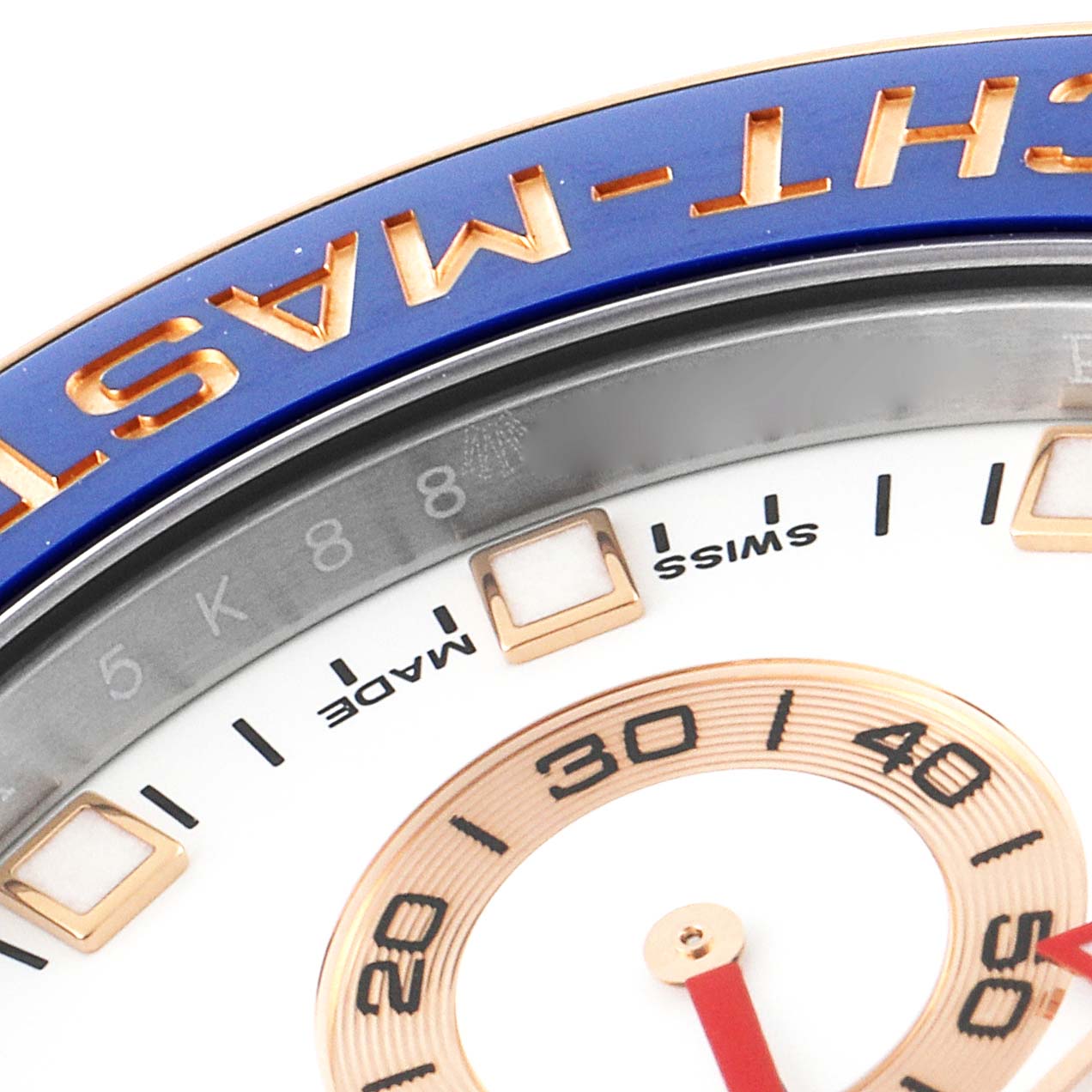 This close-up image shows the bezel and part of the dial of the Rolex Yacht-Master 116681 Men's Steel and Gold (two tone) White Dial 116681 Men's Steel and Gold (two tone) White Dial watch.