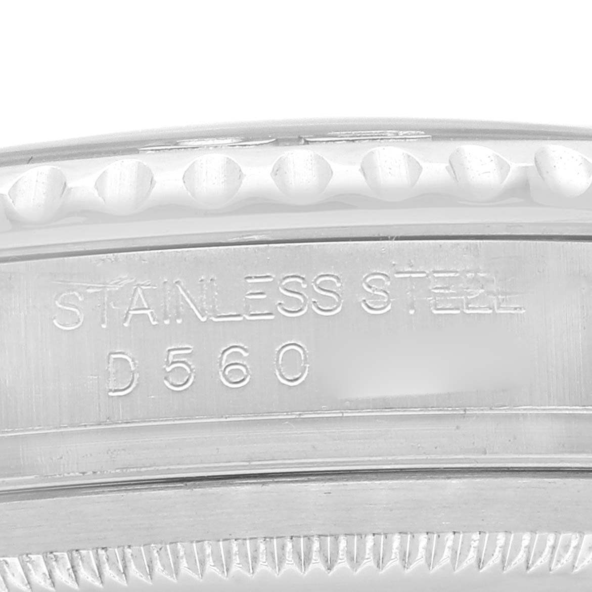 The image shows an extreme close-up of the side of a Rolex Yacht-Master 16622 Men
s Stainless Steel Silver Dial 16622 Men
s Stainless Steel Silver Dial watch, highlighting the stainless steel material and engravings.