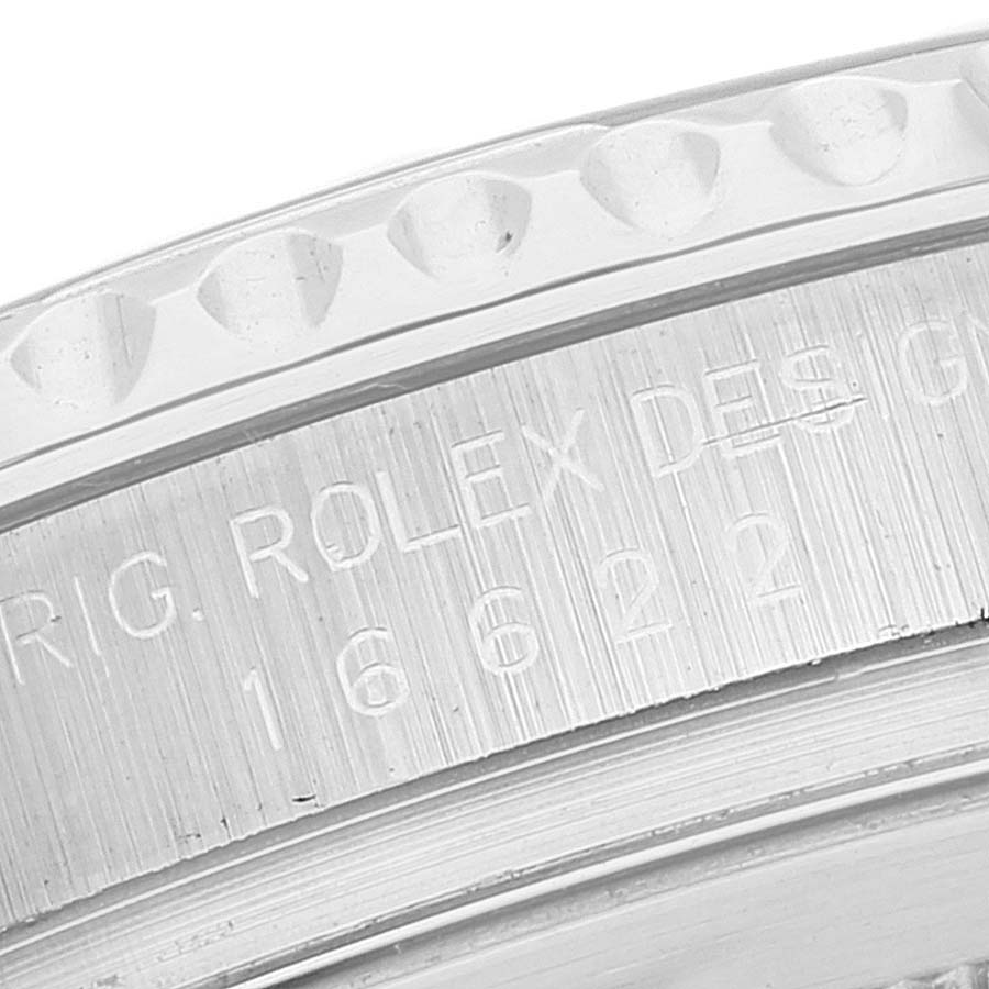This close-up image shows the engraved details on the bezel and inner case of a Rolex Yacht-Master 16622 Men
s Stainless Steel Silver Dial 16622 Men
s Stainless Steel Silver Dial.